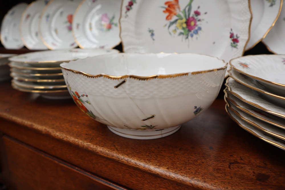 A 19th century Copenhagen porcelain part dinner set painted with garden flowers to a basket weave - Image 9 of 19