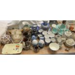 A Poole pottery part tea service together with a blue and white pottery part tea service,