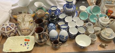 A Poole pottery part tea service together with a blue and white pottery part tea service,