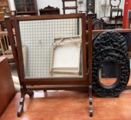 A 19th century mahogany toilet mirror together with a Chinese carved wall mirror