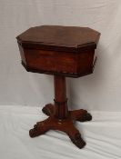 A William IV rosewood teapoy, the octagonal hinged moulded top enclosing two lidded tea caddies,