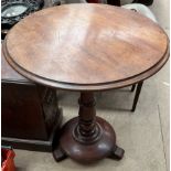 A Victorian mahogany occasional table with a circular top on a ring turned column,