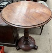 A Victorian mahogany occasional table with a circular top on a ring turned column,