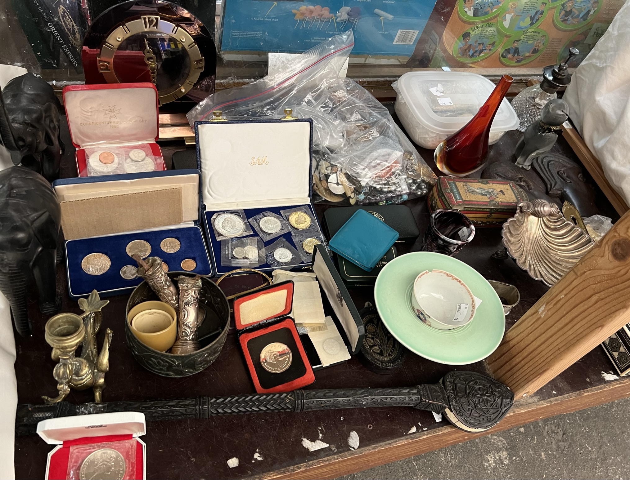 Assorted coins, together with electroplated wares, carvings, mantle clock, box and cover,