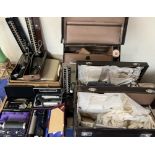 A Corona typewriter together with a collection of medical equipment contained in three cases,