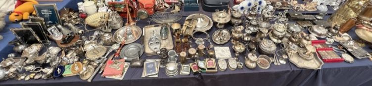 An extensive collection of electroplated wares including part tea sets, cigarette boxes and covers,