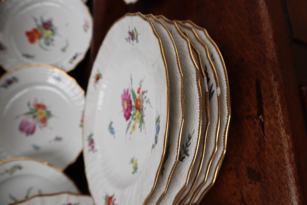 A 19th century Copenhagen porcelain part dinner set painted with garden flowers to a basket weave - Image 10 of 19