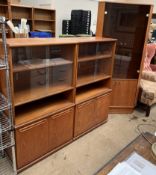 A pair of Meredew teak bookcases together with a teak standing corner cupboard ***TO BE RE-OFFERED