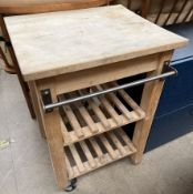 A pine butchers block of rectangular form and two shelves