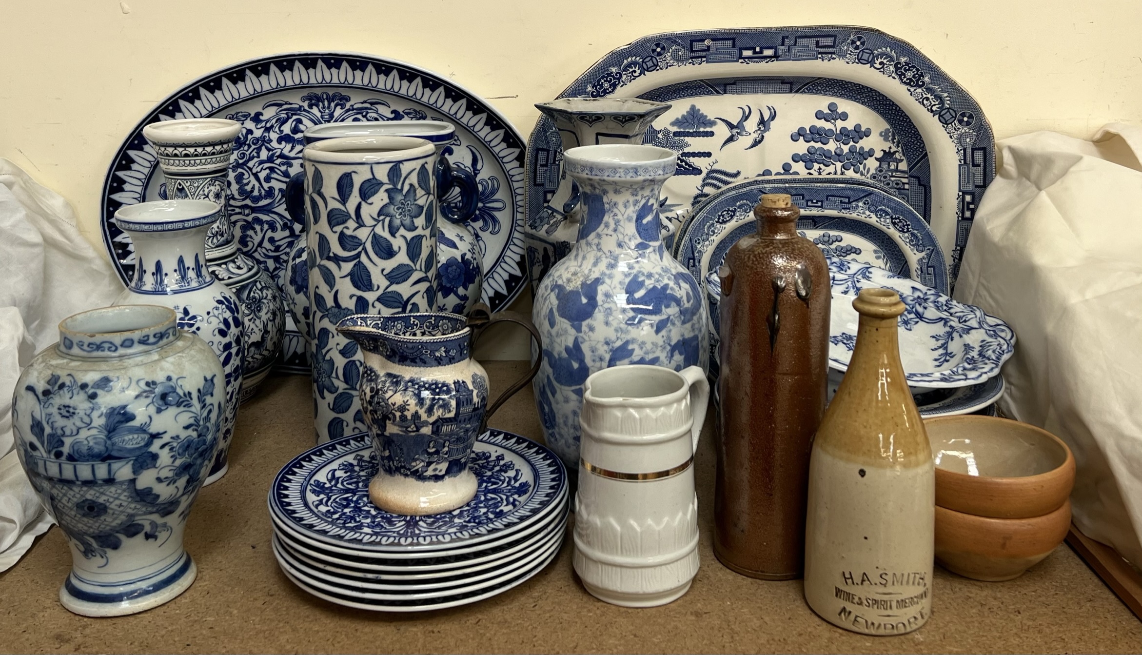 A quantity of blue and white pottery including meat plates,