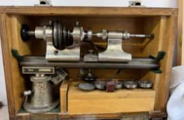 An Ime watch makers lathe, cased, together with a wedding ring gauge set,