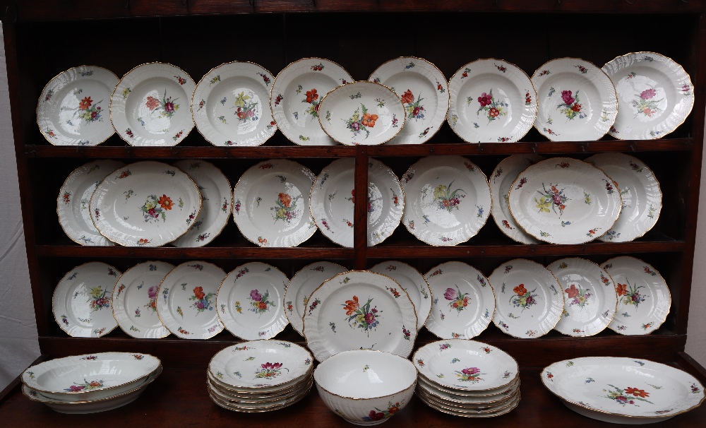 A 19th century Copenhagen porcelain part dinner set painted with garden flowers to a basket weave - Image 5 of 19