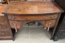 A 19th century mahogany sideboard with a D shaped top above three drawers on square tapering legs,