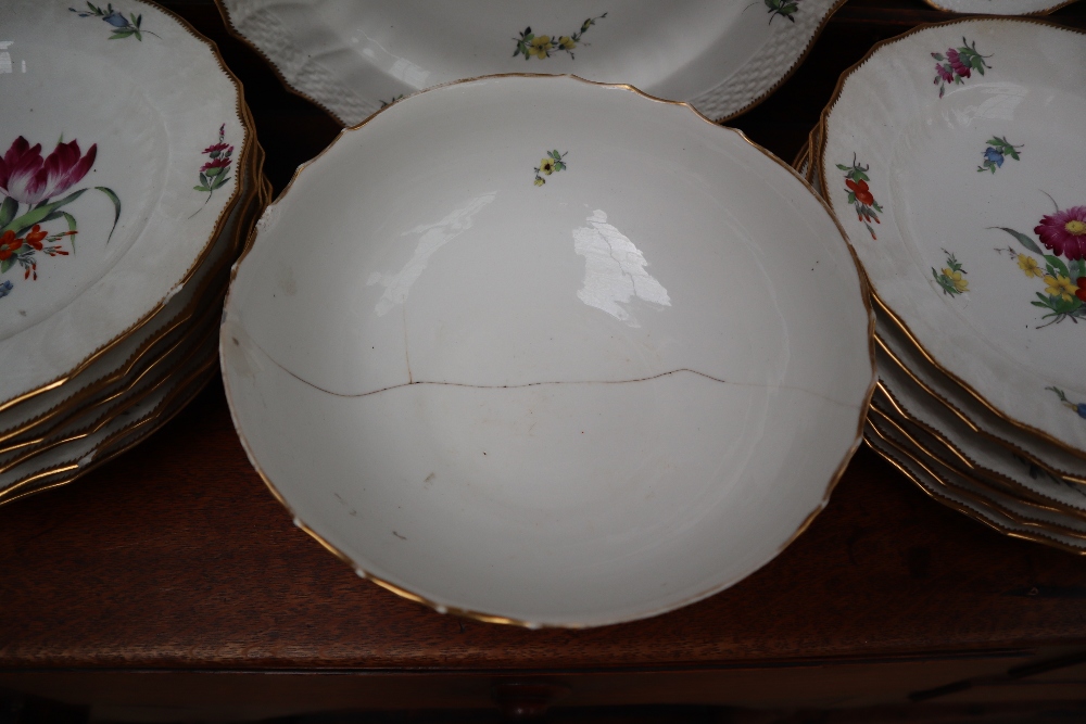 A 19th century Copenhagen porcelain part dinner set painted with garden flowers to a basket weave - Image 6 of 19