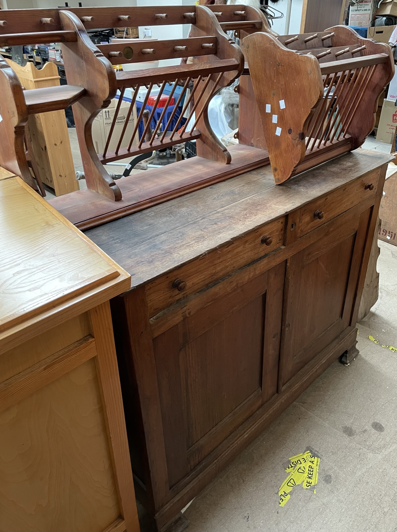 A continental pine side cabinet with a rectangular top and two drawers and two cupboards together