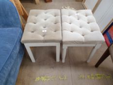 An upholstered tub chair in blue together with a pair of upholstered dressing table stools