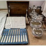 An electroplated four piece tea set together with cased flatwares