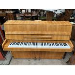 A Rogers walnut upright piano, metal framed, overstrung,