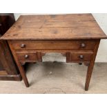 An 18th century oak lowboy, the planked rectangular top above three drawers on square legs,