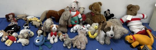 A collection of soft toys including teddy bears, lion,