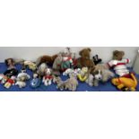 A collection of soft toys including teddy bears, lion,