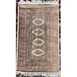 A silk and wool blend rug / wall hanging with a red ground and four medallions and multiple guard