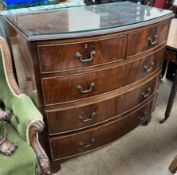 A George III mahogany chest of D shape with two short and three long drawers on bracket feet