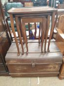 A 20th century walnut nest of three tables together with a tin trunk ***PLEASE NOTE THAT THIS LOT