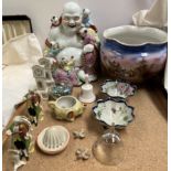 A pottery jardiniere decorated with a town scene together with a porcelain buddha, pottery bowls,