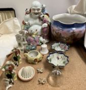 A pottery jardiniere decorated with a town scene together with a porcelain buddha, pottery bowls,