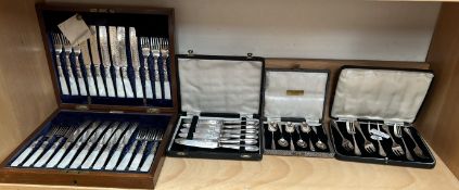 A set of six cased silver coffee spoons, together with silver cake forks,