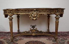 A French carved giltwood and gesso centre table with a shaped white marble top,