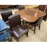An Edwardian mahogany extending dining table and four chairs,