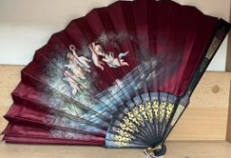 A fan painted with winged frolicking cherubs