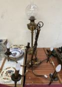 A brass oil lamp together with a brass chandelier and assorted pottery plates etc