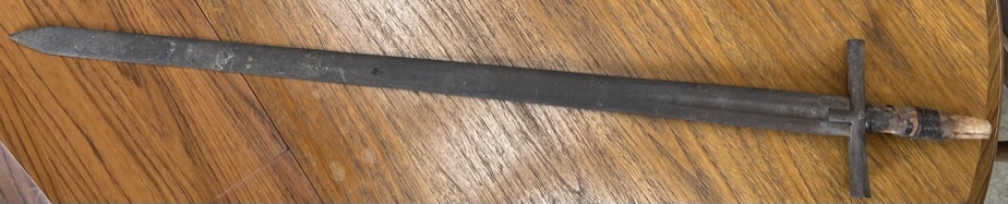 A double edged sword with a cast iron cross guard 106cm long