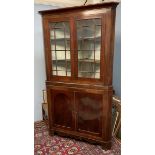 A 19th century mahogany standing corner cupboard with a glazed top and cupboard base on bracket