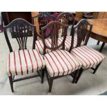 A set of three George III mahogany dining chairs together with two other dining chairs