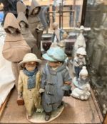 A Lladro figure "Away to School" depicting two children walking hand in hand in winter clothes, No.