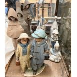 A Lladro figure "Away to School" depicting two children walking hand in hand in winter clothes, No.