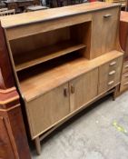 A G-Plan teak sideboard with a drinks compartment,