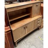 A G-Plan teak sideboard with a drinks compartment,