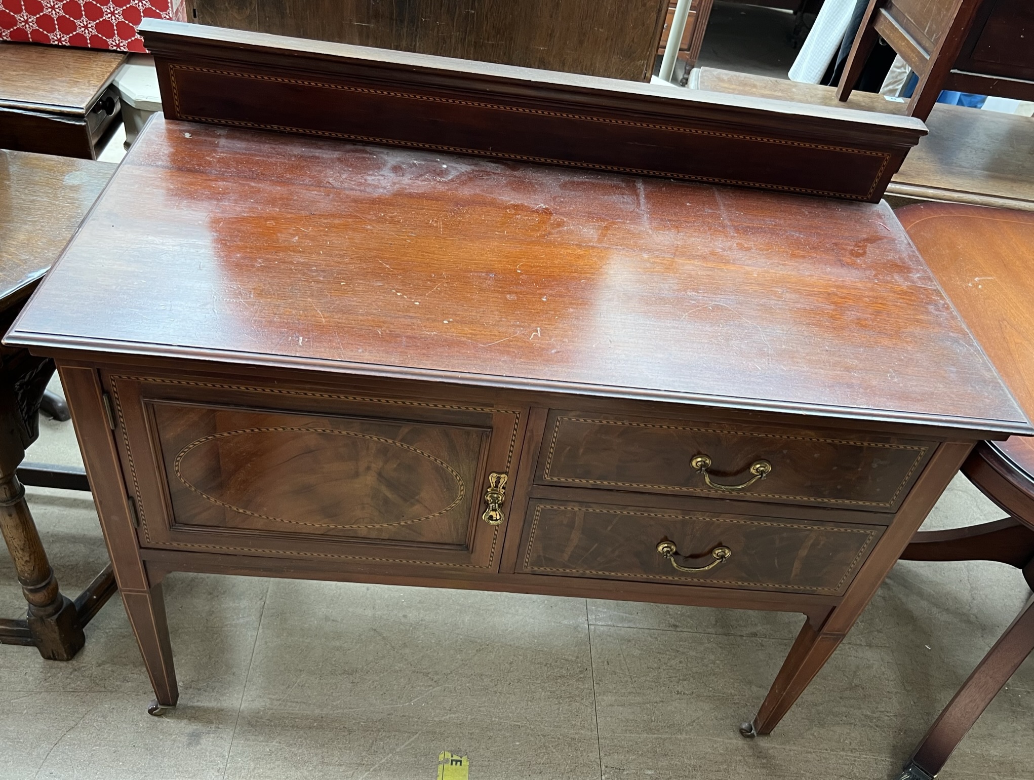 An Edwardian mahogany wash stand,