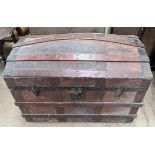 A domed trunk with wooden bands and metal ends