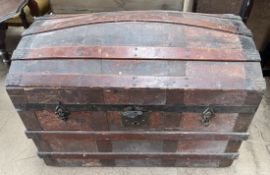 A domed trunk with wooden bands and metal ends