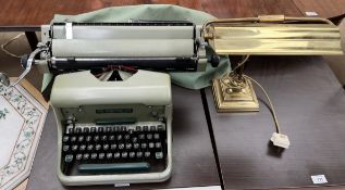 An Imperial 66 typewriter together with a brass desk lamp