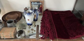 A red tasselled table cover together with a pair of pottery vases, Cadbury mirror, treen bowls,