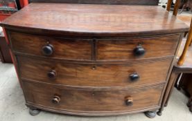 A 19th century mahogany chest with two short and two long drawers on turned legs
