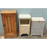 A loom laundry basket together with a wicker bedside cabinet and a limed oak bedside cabinet