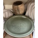 A Chinese Celadon dish, decorated with a fish together with a storage jar, bears a tag "Ex T.E.